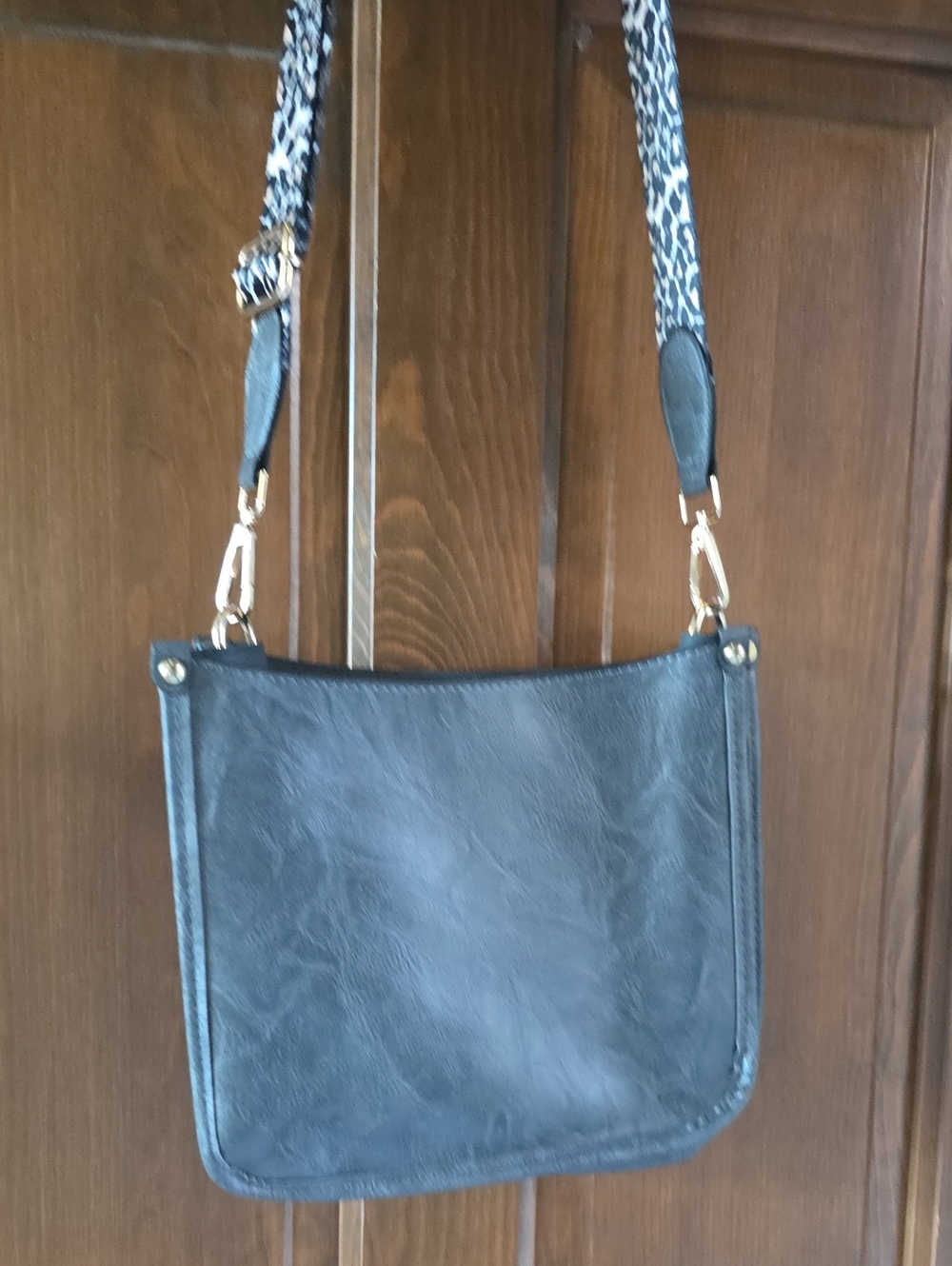 Classic Charcoal Gray Crossbody Bag with Animal Print Strap